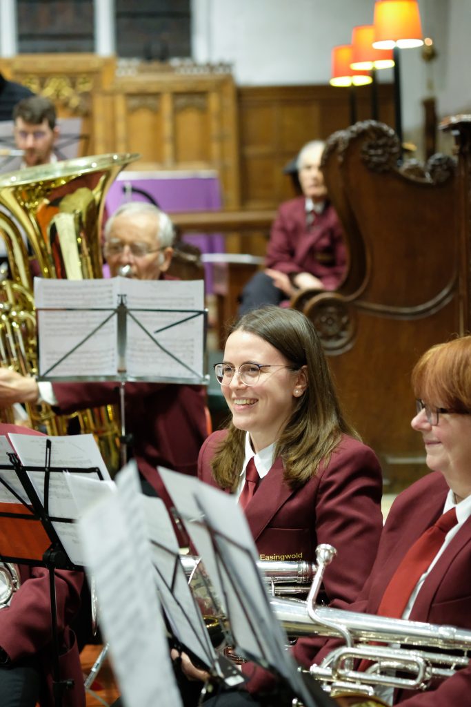 smiling woman in local brass band